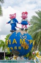 Two cute pink cat sculpture standing on a giant globe as iconic logo of Siam park city.